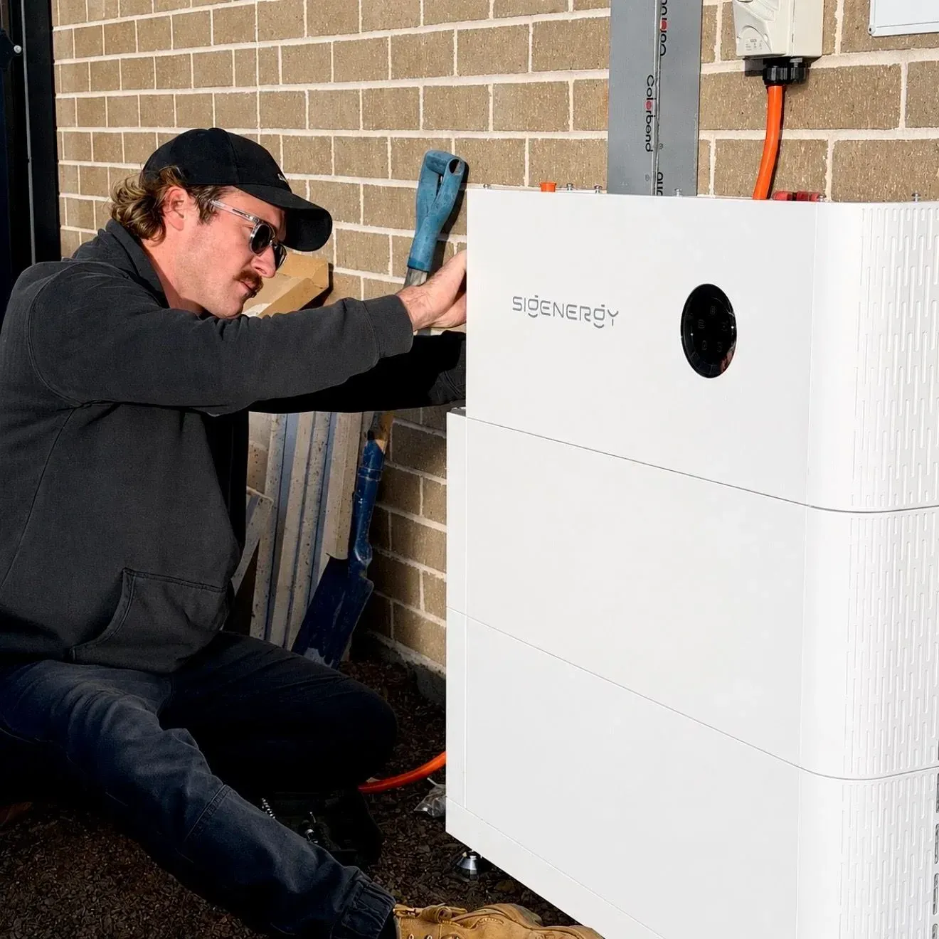 Jason fitting a Sigenergy home battery