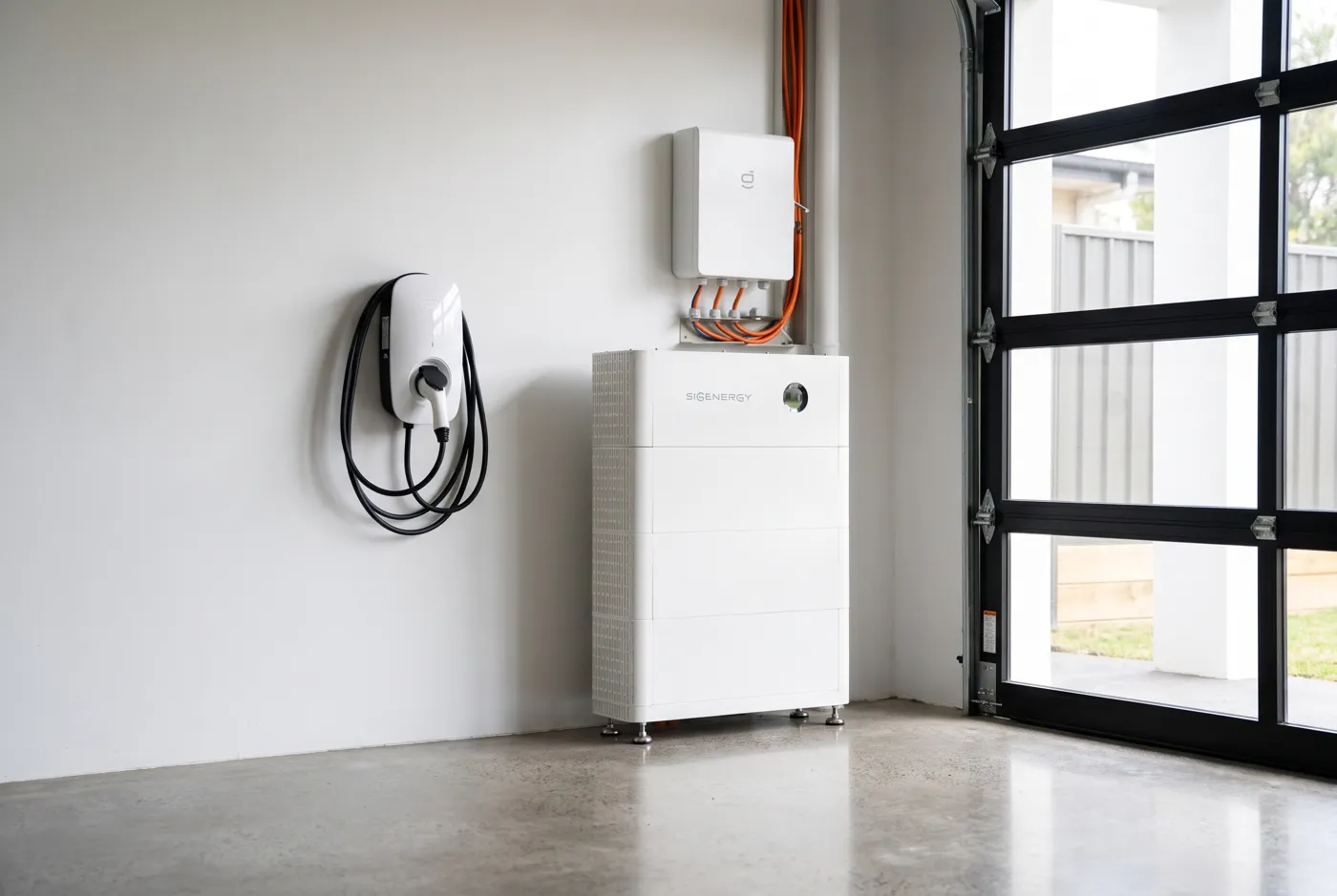 An EV wall charger in a garage