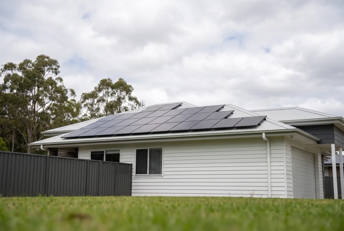 A finished solar array on a weatherboard home